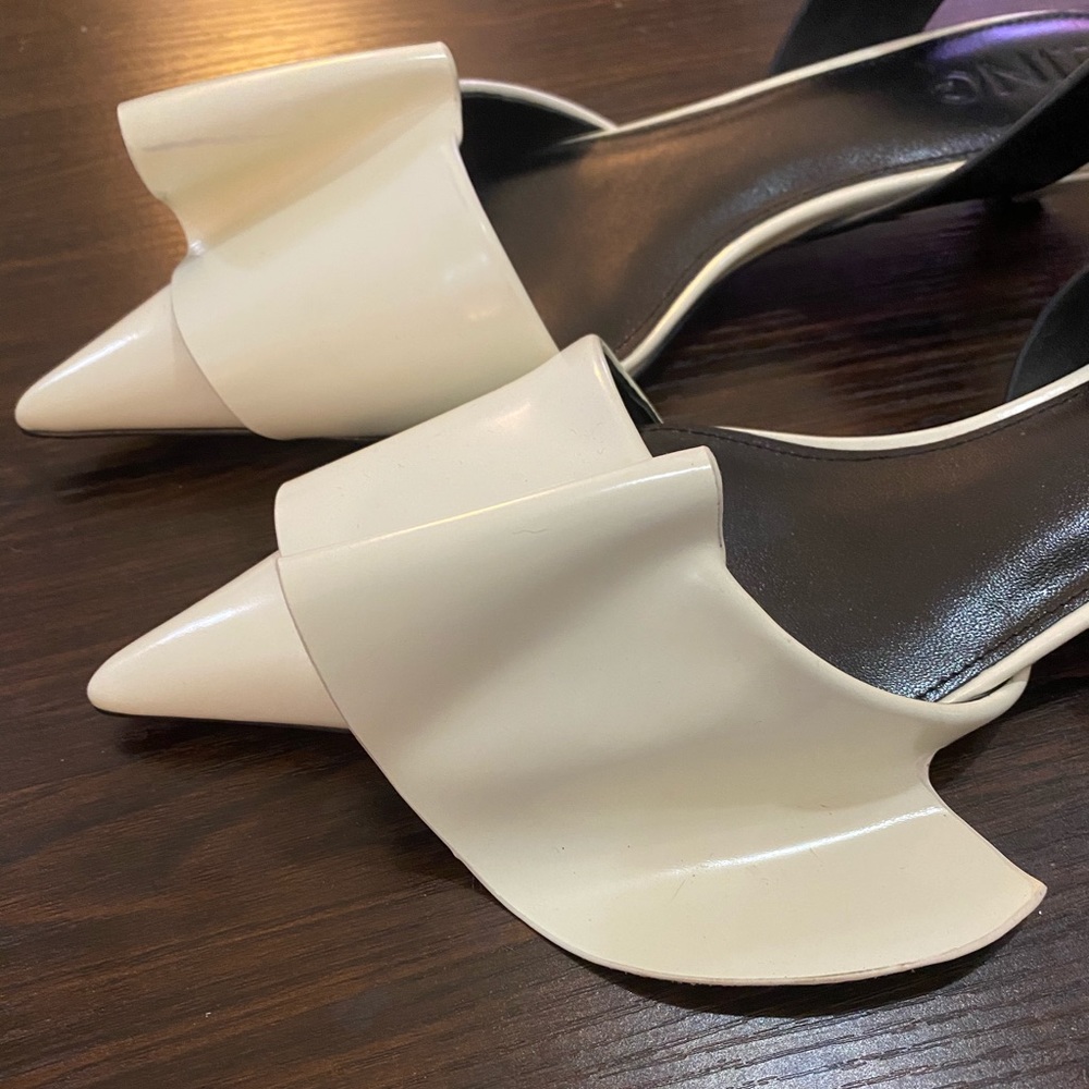 J.ing asymmetrical sculptural flats